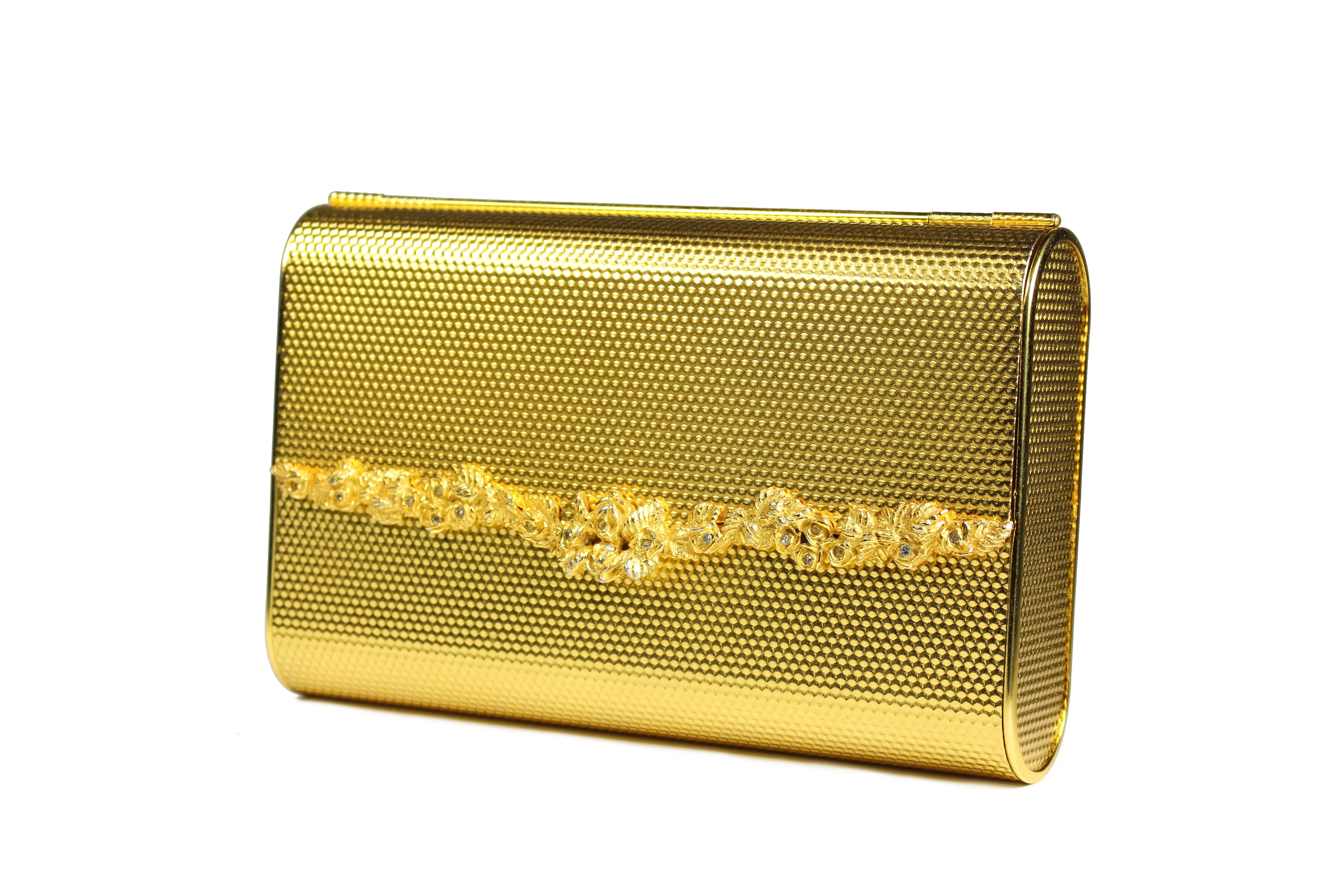 COBLENTZ embossed golden metal clutch