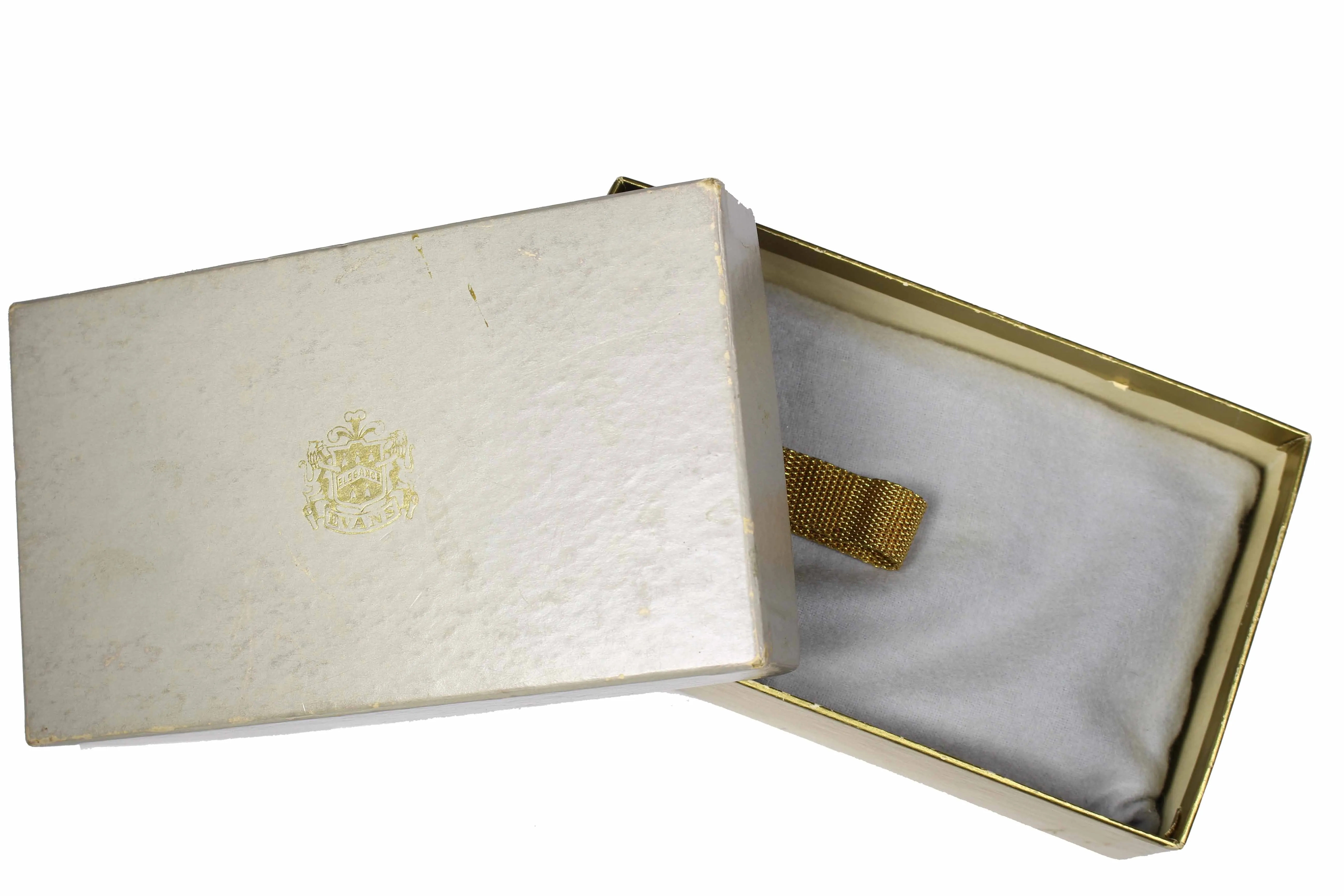 EVANS gold embossed metal vanity purse